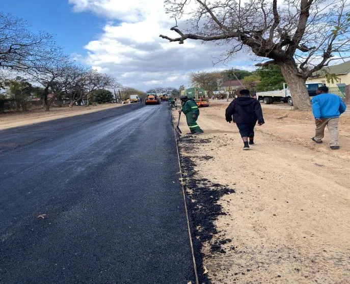 Asphalt wearing course being laid on the Rerekai Tagwena road