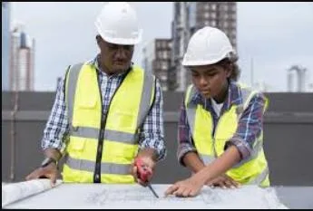 Engineers reviewing construction drawings
